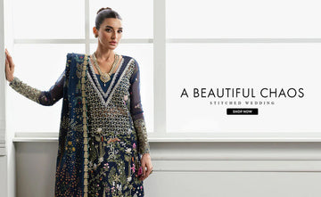 Elegant traditional Pakistani wedding outfit with intricate embroidery.