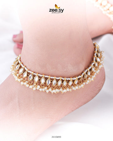 Merlino Anklets - Designer Dress with Intricate embroidery and embellishments. Shop elegent wedding dress at Maria Faisal.
