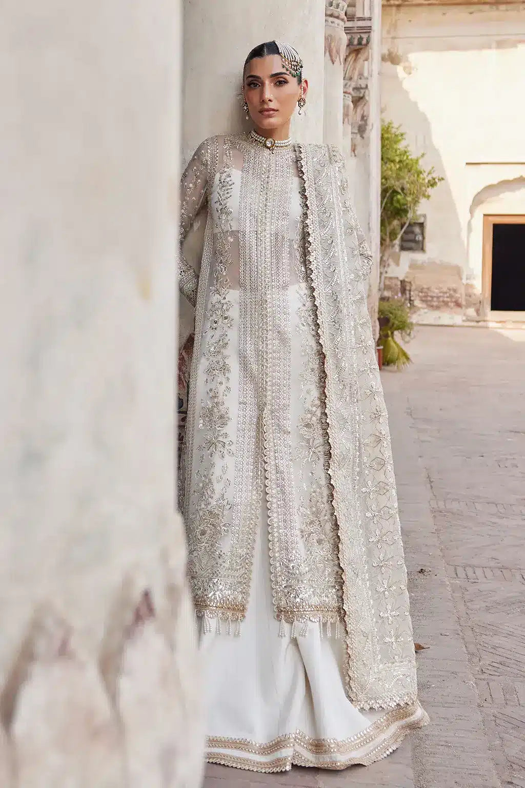 Afrozeh Dastangoi Wedding Formals Noori– Off White Pakistani Dress with intricate embroidery and embellishments. Shop elegant Asian dresses at Maria Faisal.