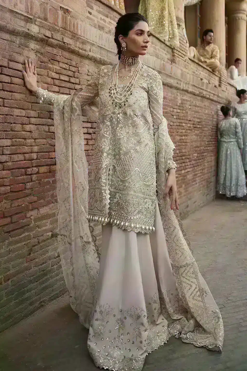 Afrozeh Dastangoi Wedding Formals Meharbano– Powder Pink Pakistani Dress with intricate embroidery and embellishments. Shop elegant Asian dresses at Maria Faisal.