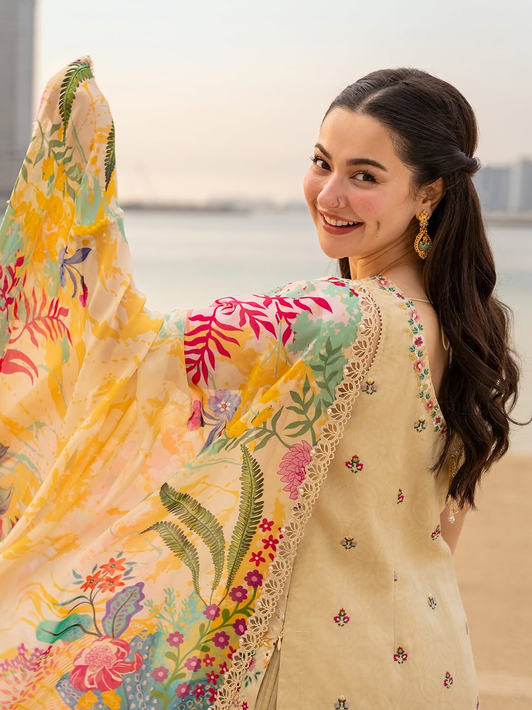 Hania Amir Wearing Light Yellow Shirt with Crushed Sharara Merjem from Faiza Saqlain Aya Luxury Lawn - Back look - Available for women in UK and USA.