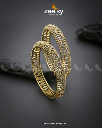 Umaimah's Bangles - Designer Dress with Intricate embroidery and embellishments. Shop elegent wedding dress at Maria Faisal.
