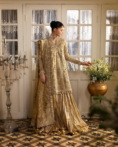 Model Wearing Light Gold Gharara with Shirt for Mehndi at Maria Faisal in UK.
