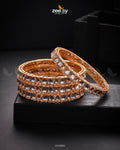 Kavya Bangles - Designer Dress with Intricate embroidery and embellishments. Shop elegent wedding dress at Maria Faisal.