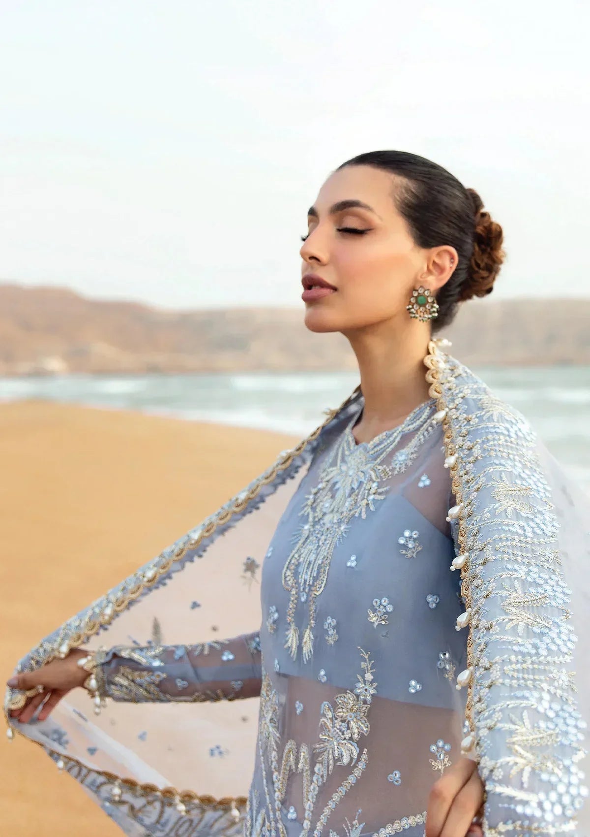 Afrozeh Dastangoi Wedding Formal'24 AWE-01 NASHMIA - Ice Blue Pakistani Dress with intricate embroidery and embellishments. Shop elegant Asian dresses at Maria Faisal.
