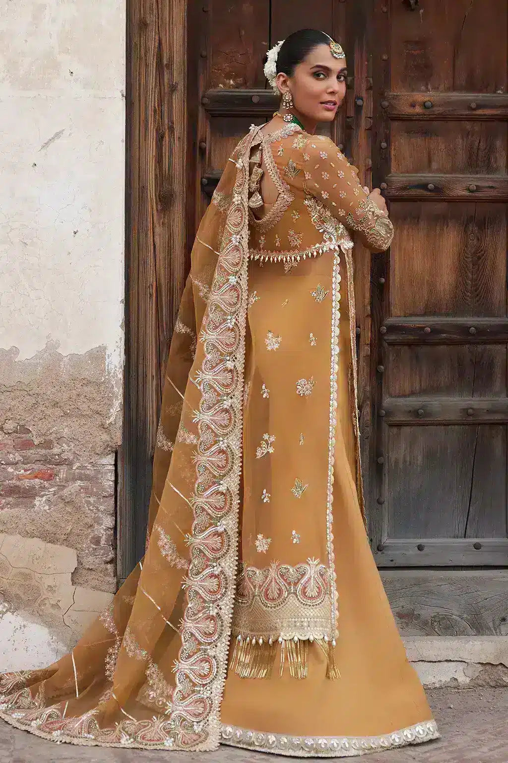 Afrozeh Dastangoi Wedding Formals Shafaq – Mustard Orange Pakistani Dress with intricate embroidery and embellishments. Shop elegant Asian dresses at Maria Faisal.