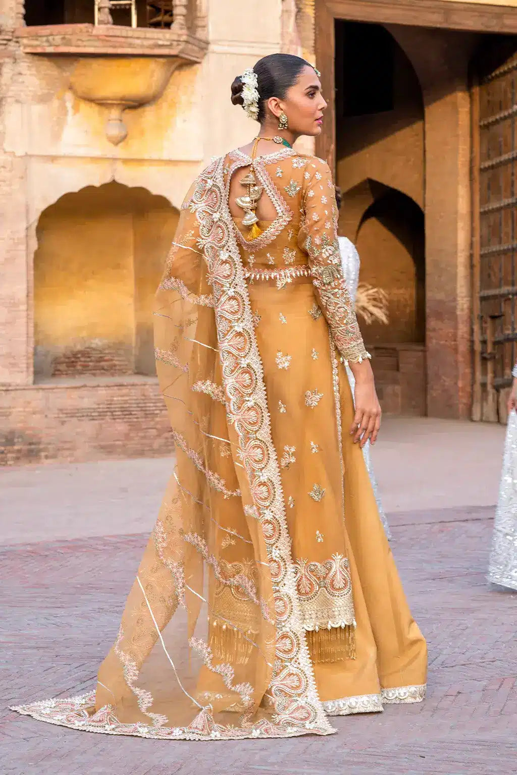 Afrozeh Dastangoi Wedding Formals Shafaq – Mustard Orange Pakistani Dress with intricate embroidery and embellishments. Shop elegant Asian dresses at Maria Faisal.