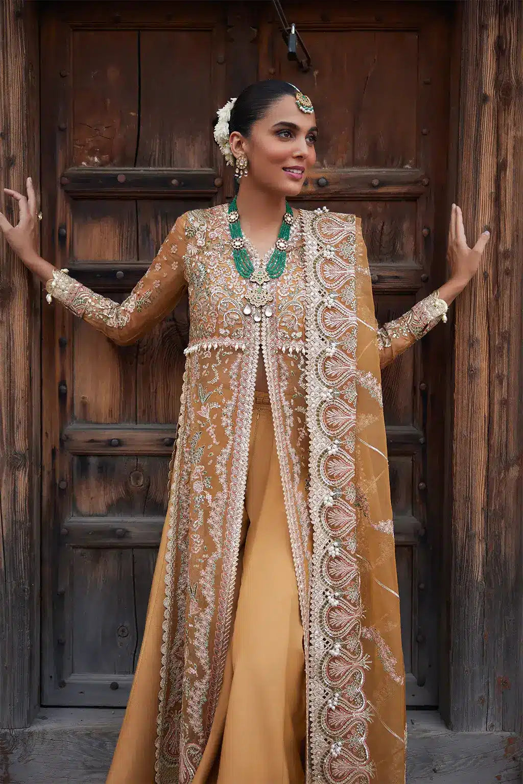 Afrozeh Dastangoi Wedding Formals Shafaq – Mustard Orange Pakistani Dress with intricate embroidery and embellishments. Shop elegant Asian dresses at Maria Faisal.
