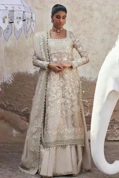 Afrozeh Dastangoi Wedding Formals Ulfat – Ivory Pakistani Dress with intricate embroidery and embellishments. Shop elegant Asian dresses at Maria Faisal.